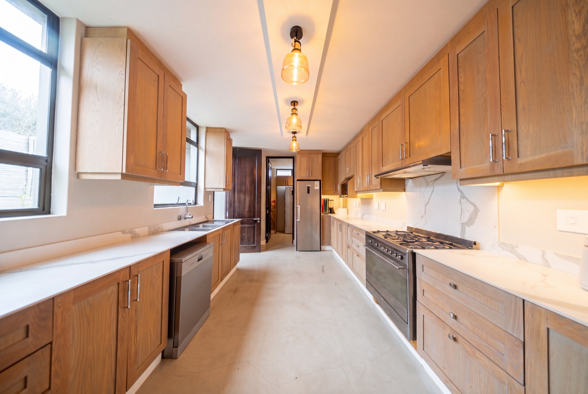 The kitchen in solid timber and marble
