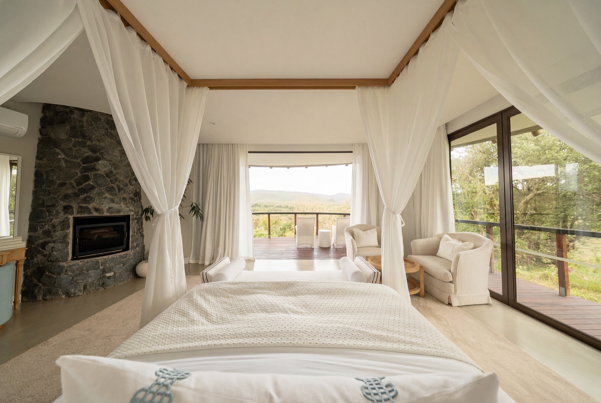 Canopied bed beside the suite fireplace